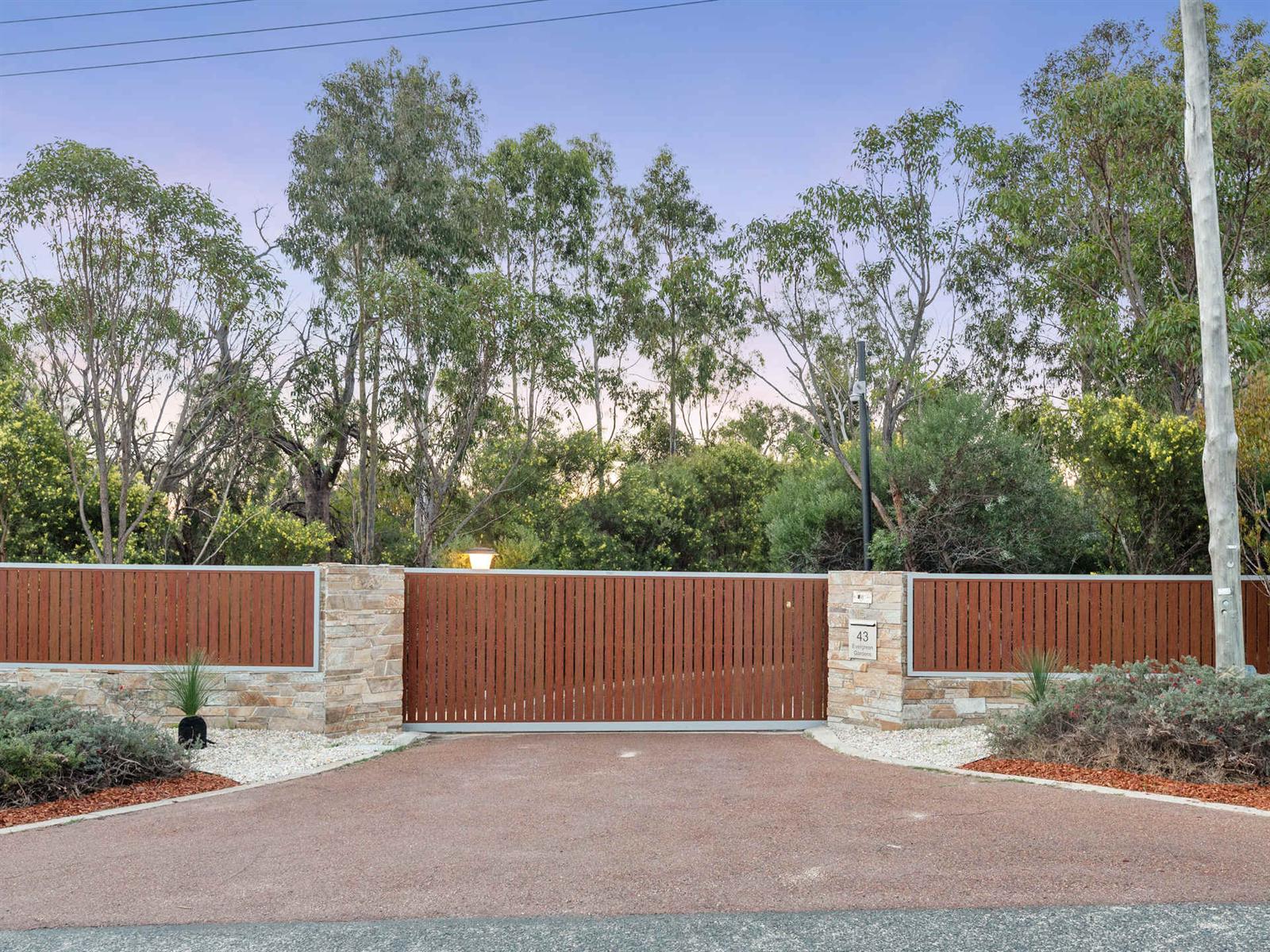 Electric gates and stone feature walls